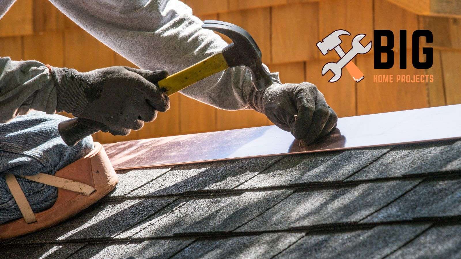 Roofer using a hammer to nail in a roof - bighomeprojects.com