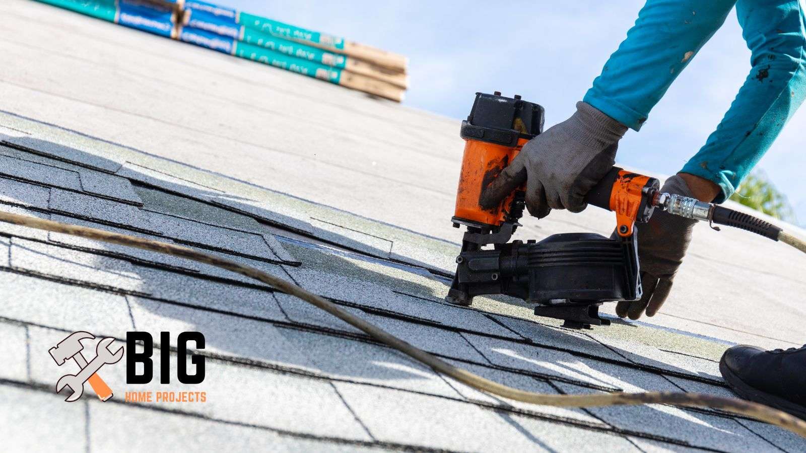 Roofer using a roofing nail on the roof - bighomeprojects.com
