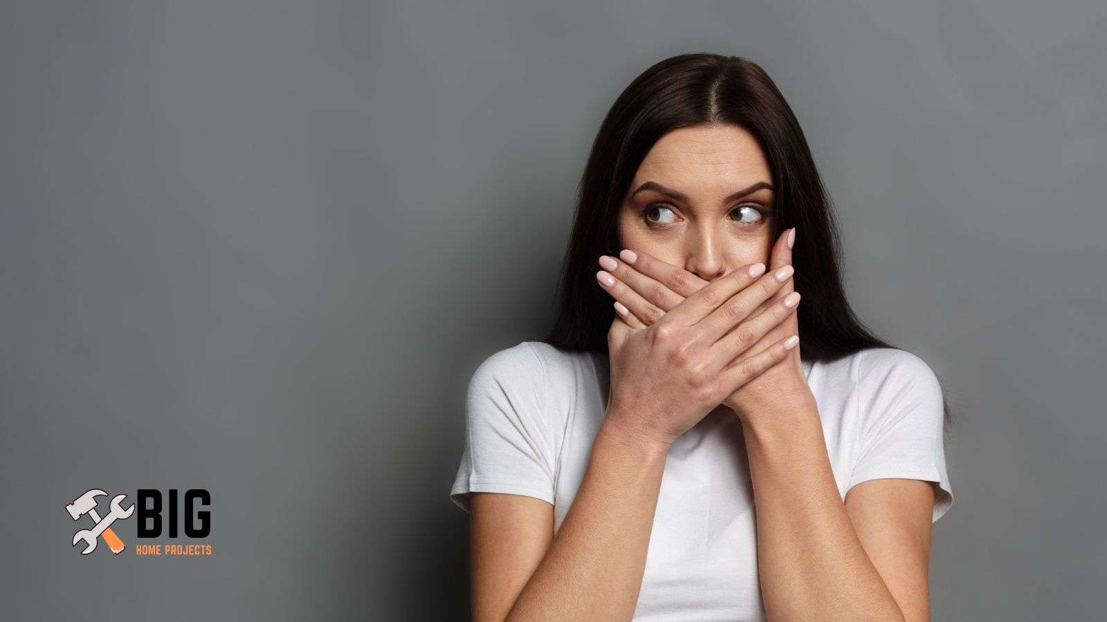 Lady with hands covering mouth - bighomeprojects.com