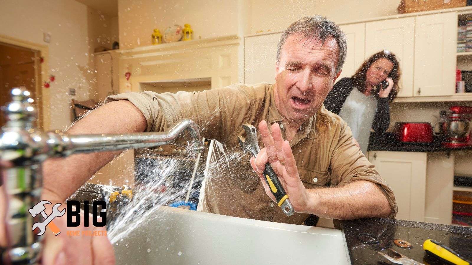 Man trying to fix a leaky faucet - bighomeprojects.com