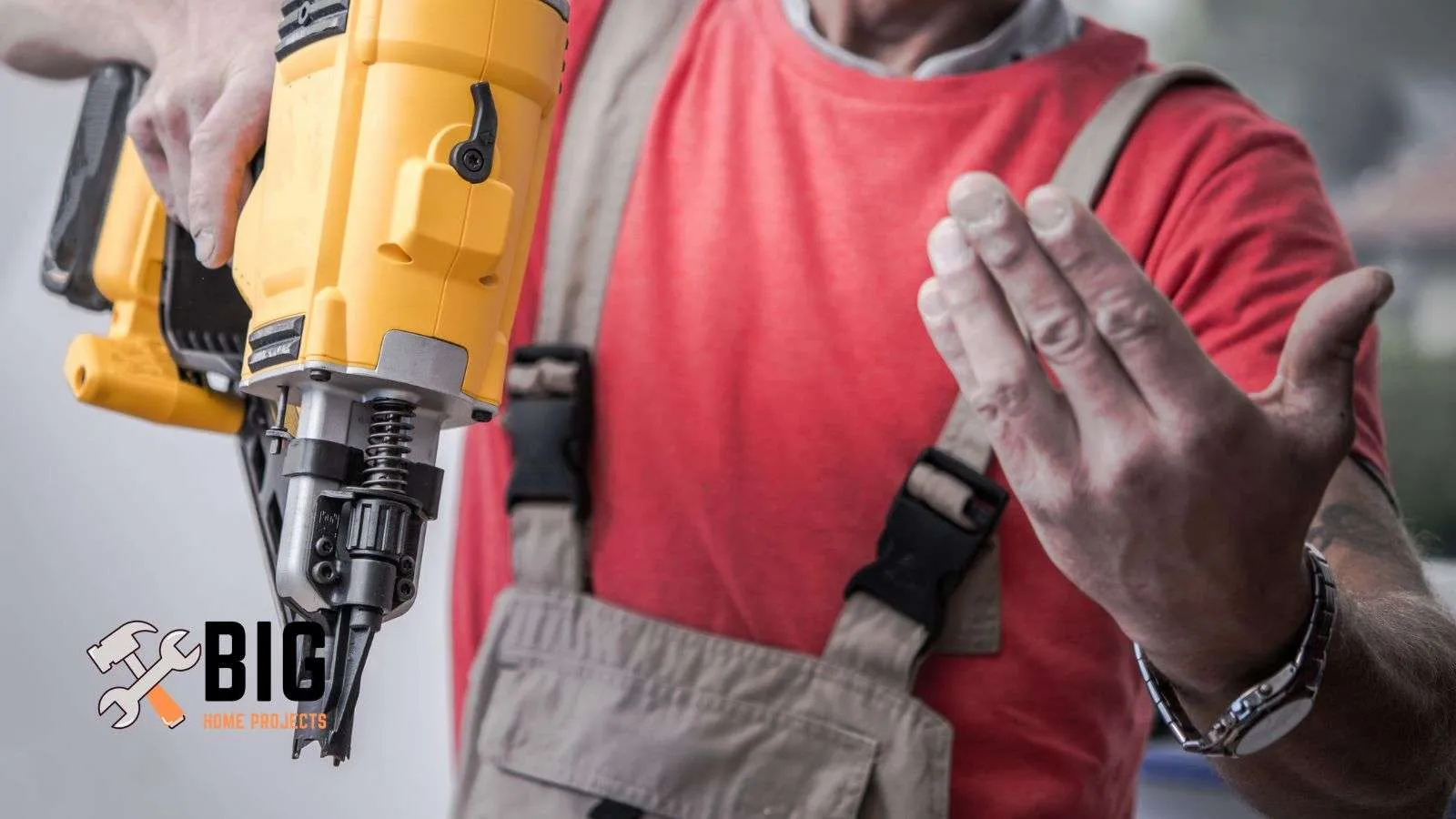 Roofer holding an air gun - bighomeprojects.com