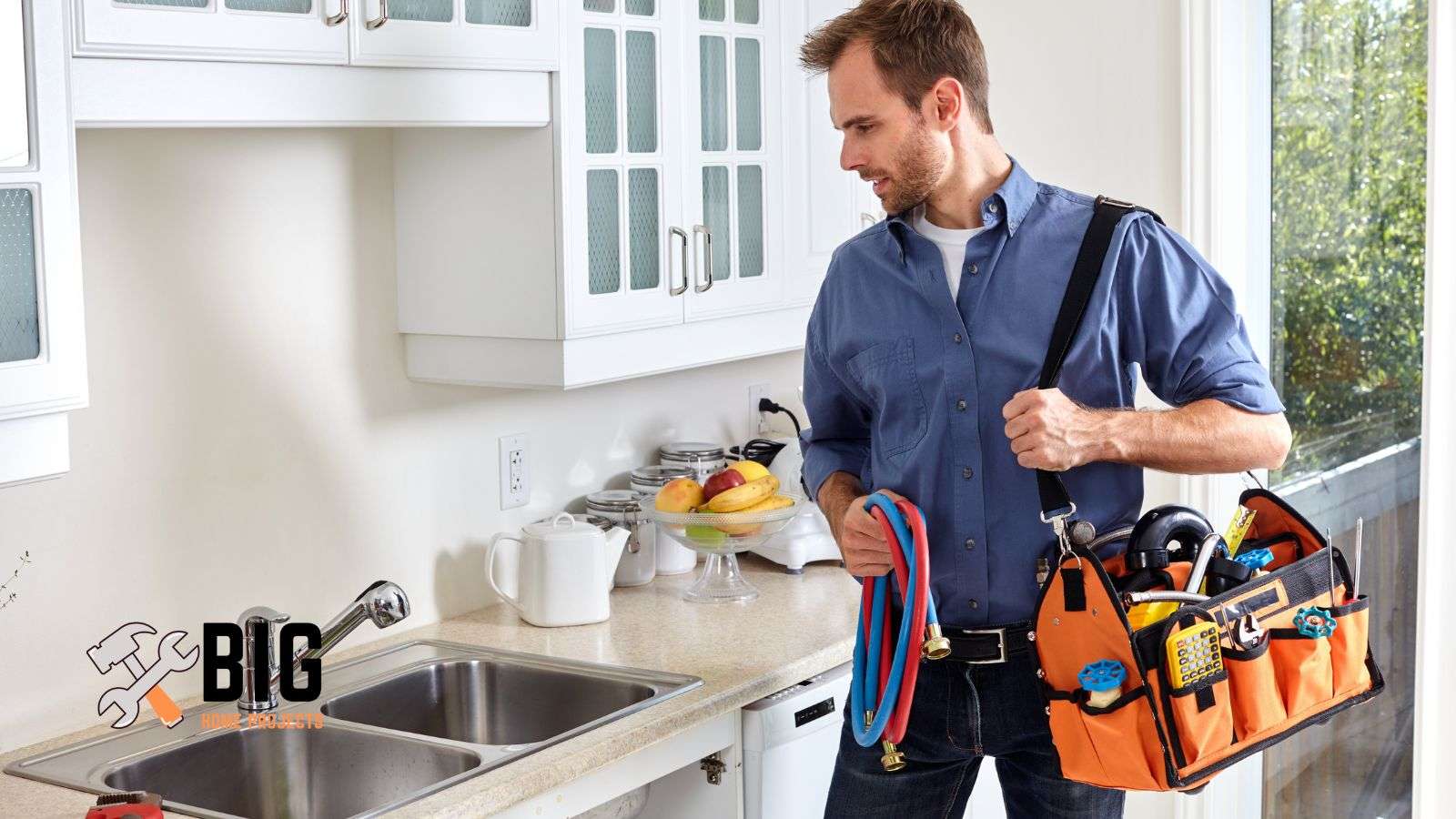 Plumber looking at the sink - bighomeprojects.com