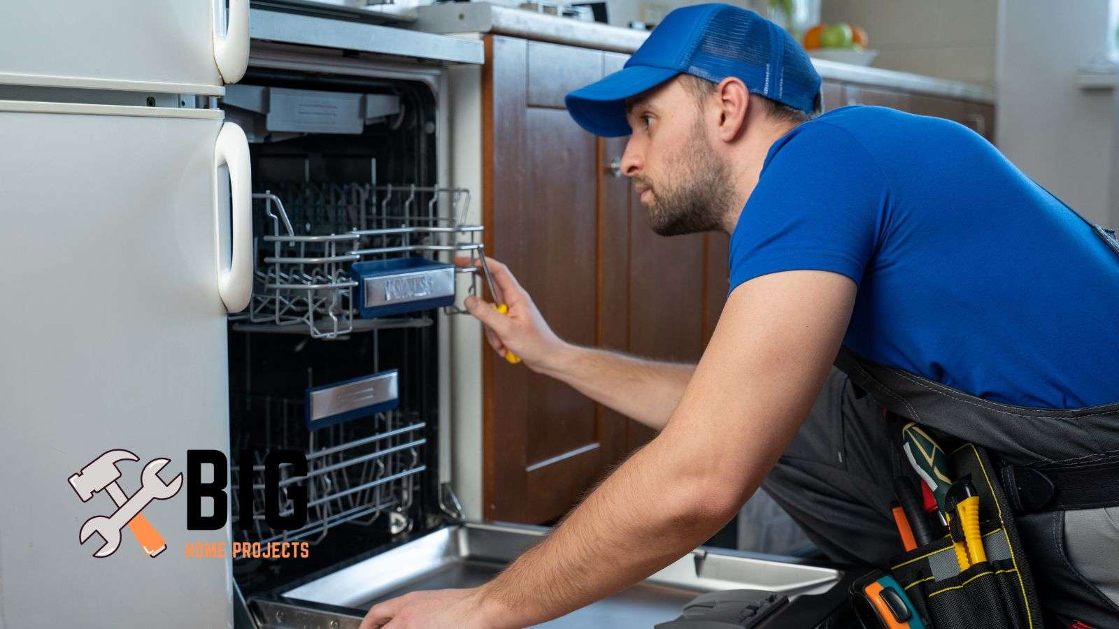 Plumber working on dishwasher - bighomeprojects.com