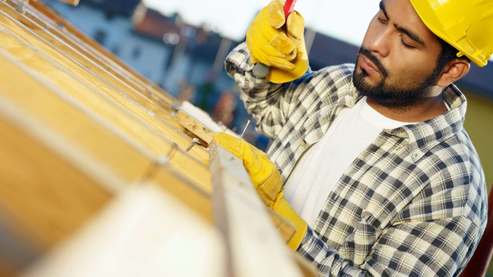 Professional roofer hammering - bighomeprojects.com