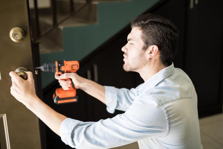 profile view attractive handyman using power drill fix door knob house 662251 2747 768x512